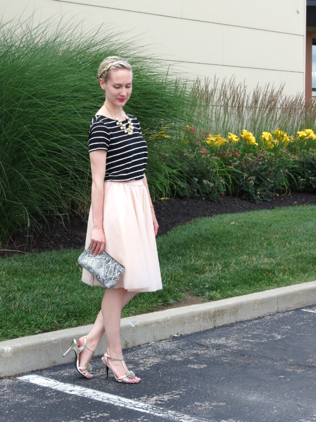 striped tee, tutu skirt, snakeskin clutch, cluster pearl necklace, inside out french braid