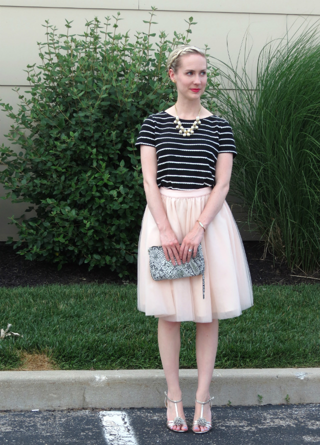 striped tee, tutu skirt, snakeskin clutch, cluster pearl necklace, inside out french braid